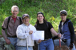 Scholarship recipient Crystal Martinez (2nd from right) with Board Members John Goers, Mike Orvis and Deb Dight